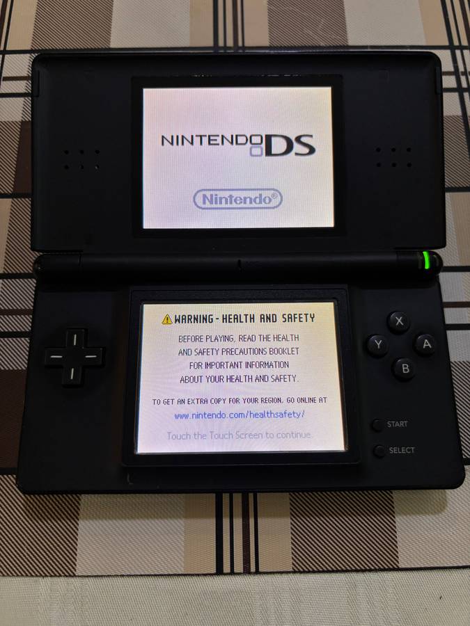 black Nintendo DS Lite with charger, stylus & free game