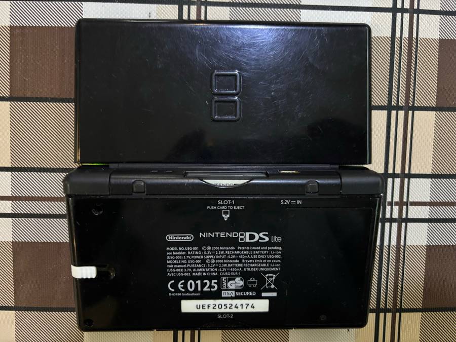 black Nintendo DS Lite with charger, stylus & free game