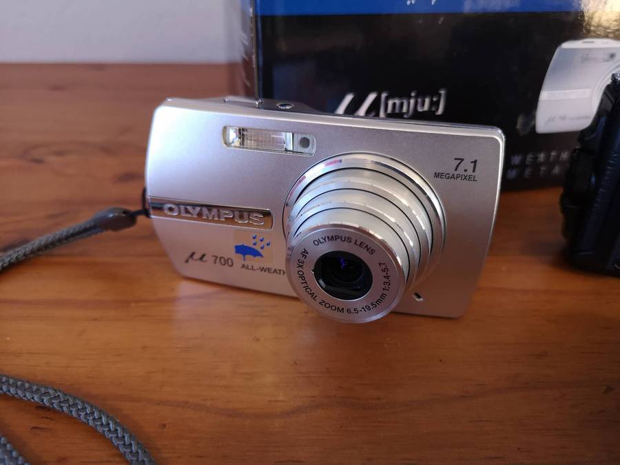 Two faulty digital compact cameras **Nikon & Olympus**