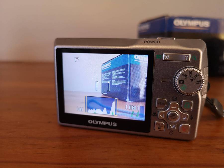 Two faulty digital compact cameras **Nikon & Olympus**