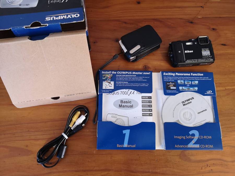 Two faulty digital compact cameras **Nikon & Olympus**