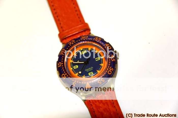 SDK106 Swatch - Scuba Red Island Hands Glow Classic - Clearance SALE