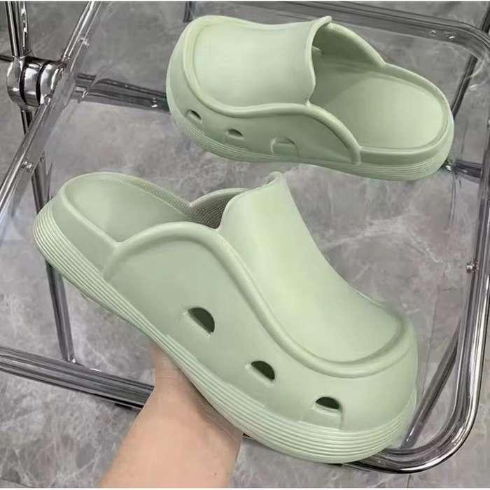 Thick bottom closed toe porous shoes.