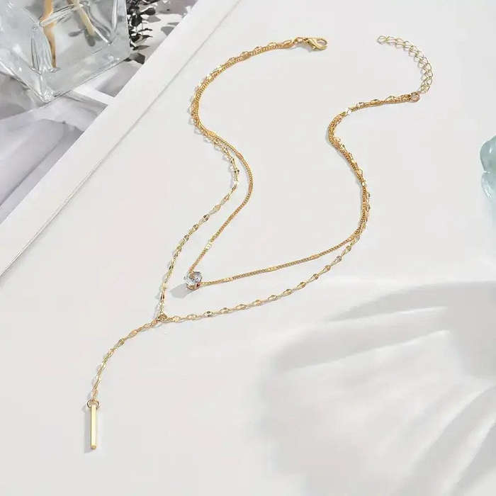Multi Layered Gold Tone Necklace with White Gemstone