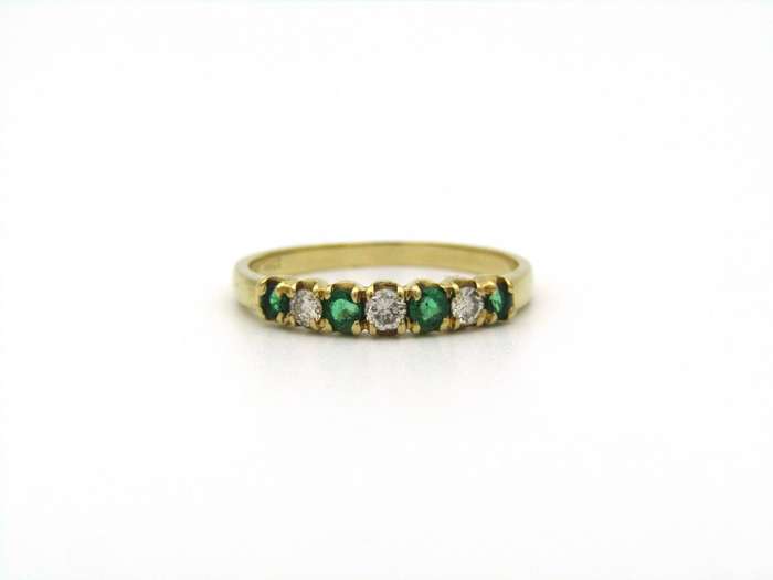 18K gold emerald and diamond ring.