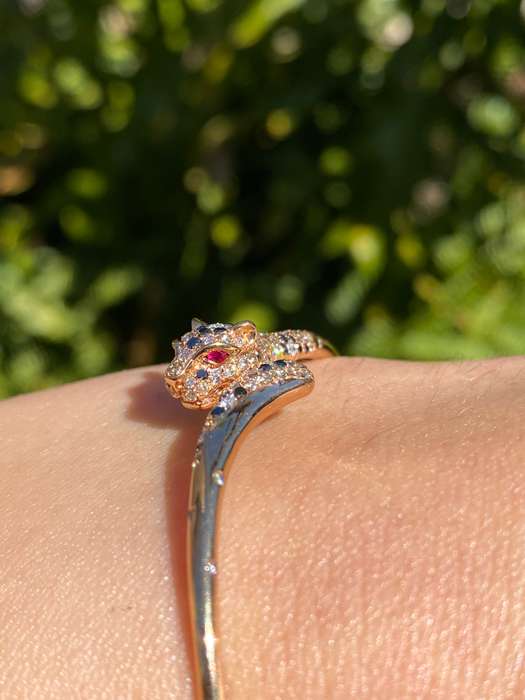 18K gold ruby and diamond leopard bangle.