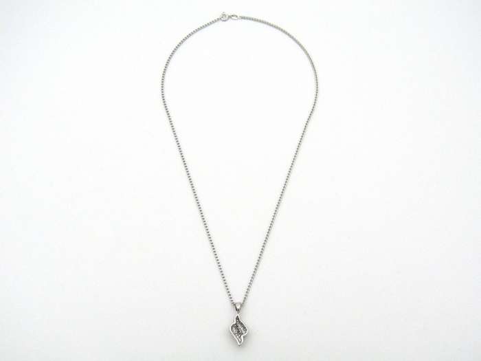 14K gold diamond pendant.