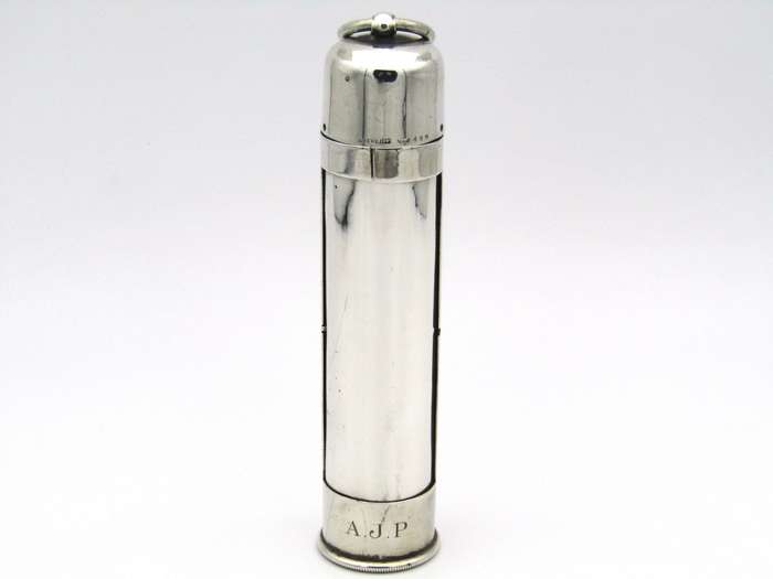 Sterling silver thermometer with swivelling case.