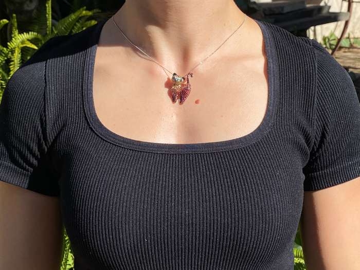 18K gold fancy sapphire, tsavorite garnet and diamond cat pendant/brooch.