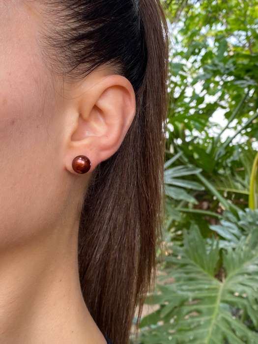 9K gold freshwater pearl stud earrings.