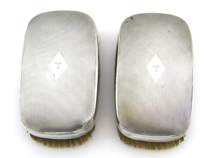 A pair of silver clothes brushes by Charles Packer & Co, London, 1929.