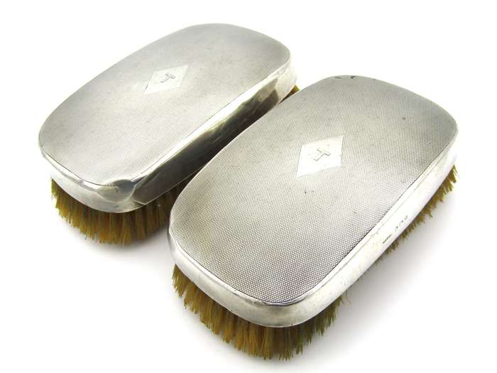 A pair of silver clothes brushes by Charles Packer & Co, London, 1929.