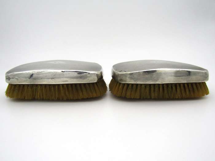 A pair of silver clothes brushes by Charles Packer & Co, London, 1929.