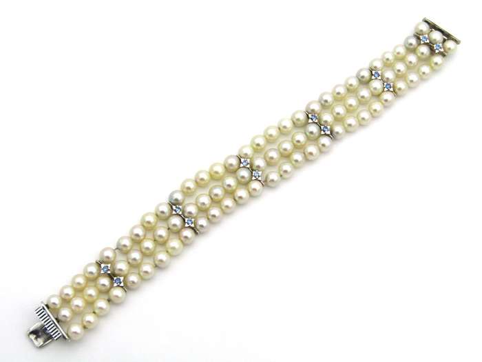 18K gold three-strand akoya cultured pearl bracelet, circa 1980's.