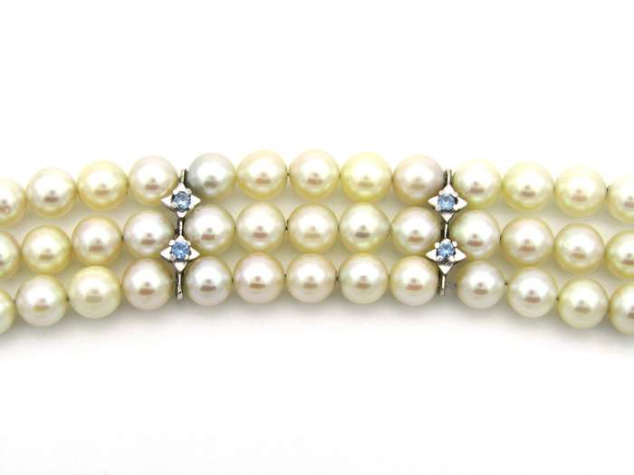 18K gold three-strand akoya cultured pearl bracelet, circa 1980's.