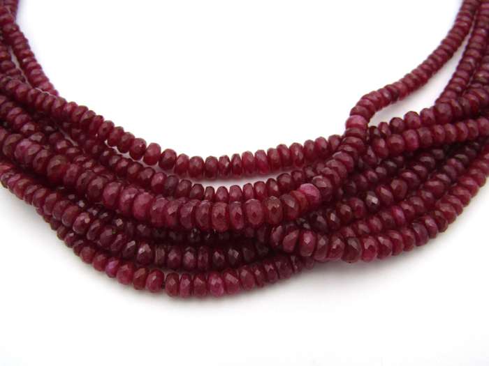 14K gold diamond and 7-strand ruby necklace.