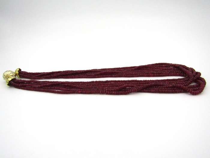 14K gold diamond and 7-strand ruby necklace.