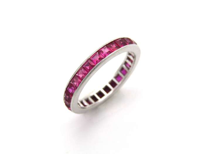 Platinum synthetic ruby eternity ring, circa 1990's.