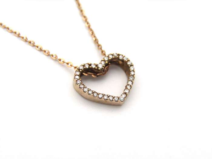 9K gold diamond heart pendant.