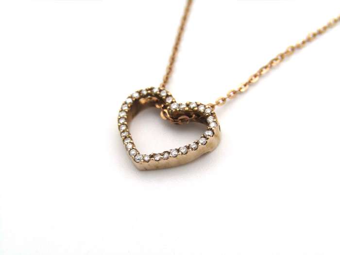 9K gold diamond heart pendant.
