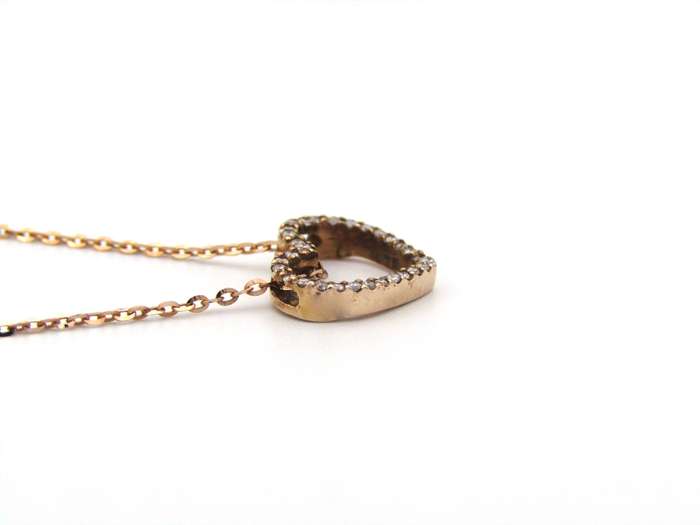 9K gold diamond heart pendant.