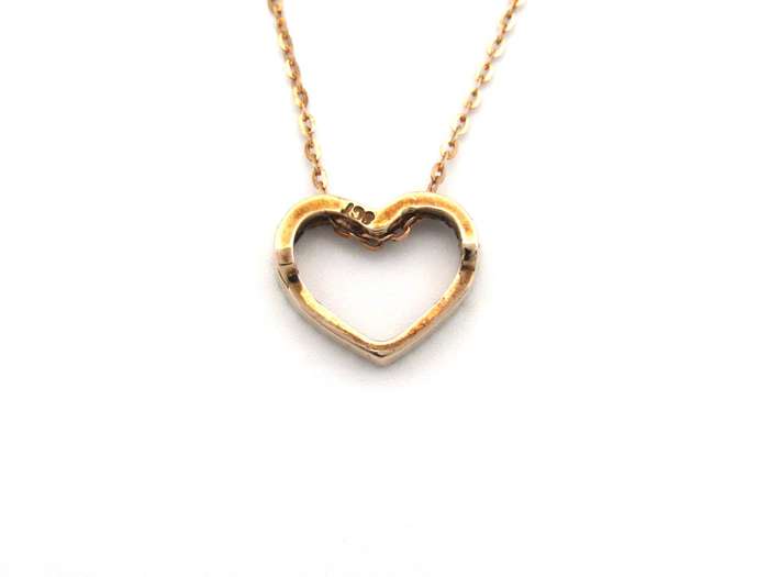 9K gold diamond heart pendant.
