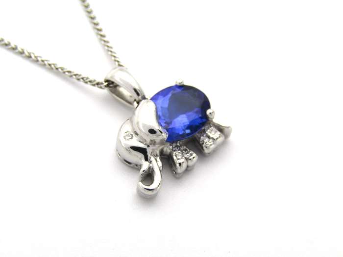 18K gold tanzanite and diamond elephant pendant.