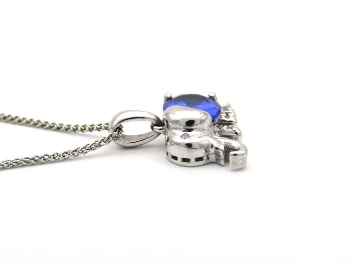 18K gold tanzanite and diamond elephant pendant.
