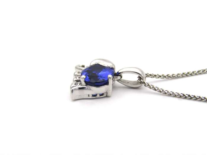 18K gold tanzanite and diamond elephant pendant.