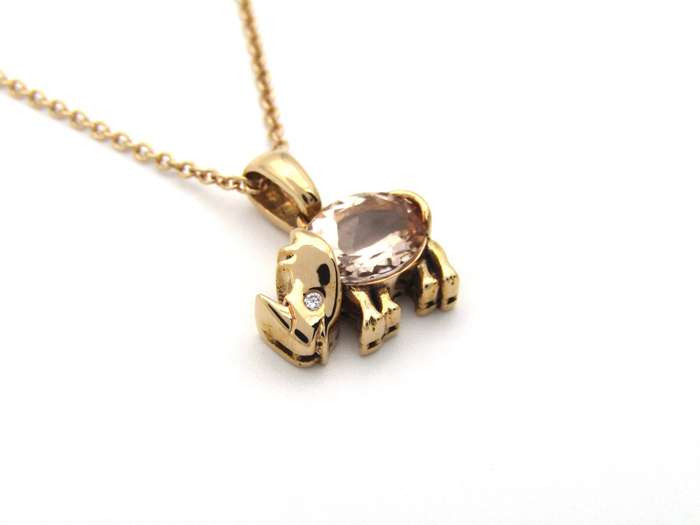 18K gold morganite and diamond rhino pendant.