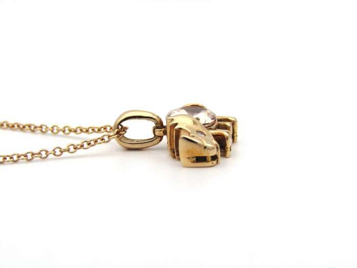 18K gold morganite and diamond rhino pendant.