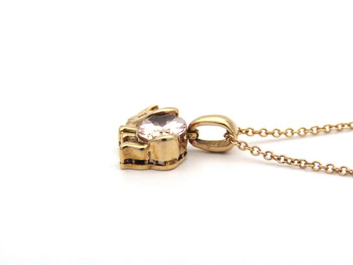 18K gold morganite and diamond rhino pendant.