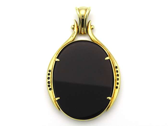 18K gold hard stone cameo and diamond pendant.