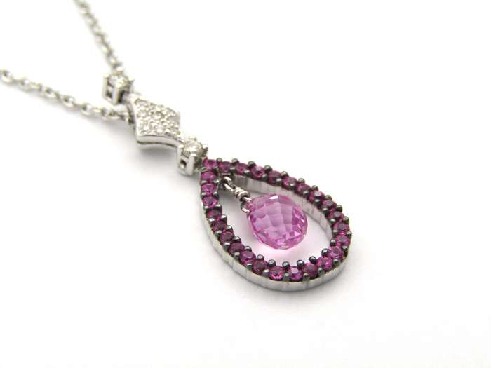 18K gold pink sapphire and diamond pendant.