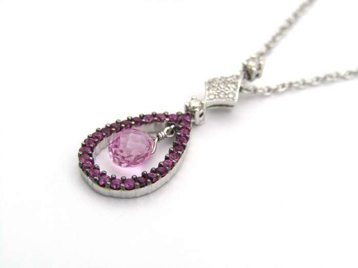 18K gold pink sapphire and diamond pendant.