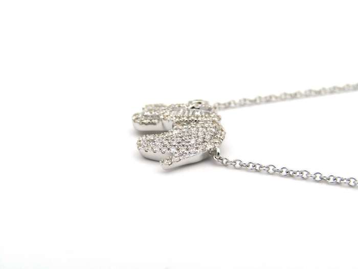 18K gold diamond elephant necklace.