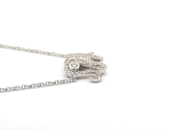 18K gold diamond elephant necklace.