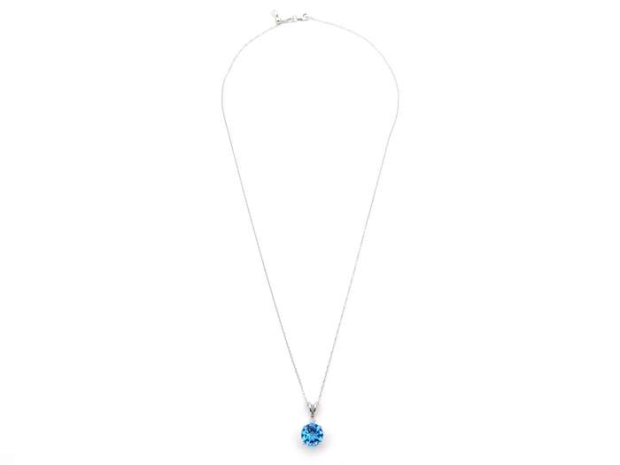 9K gold blue topaz and diamond pendant.