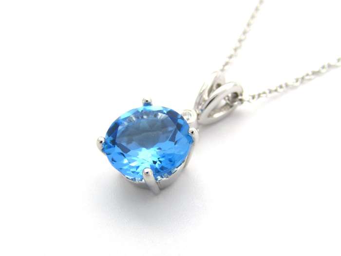 9K gold blue topaz and diamond pendant.