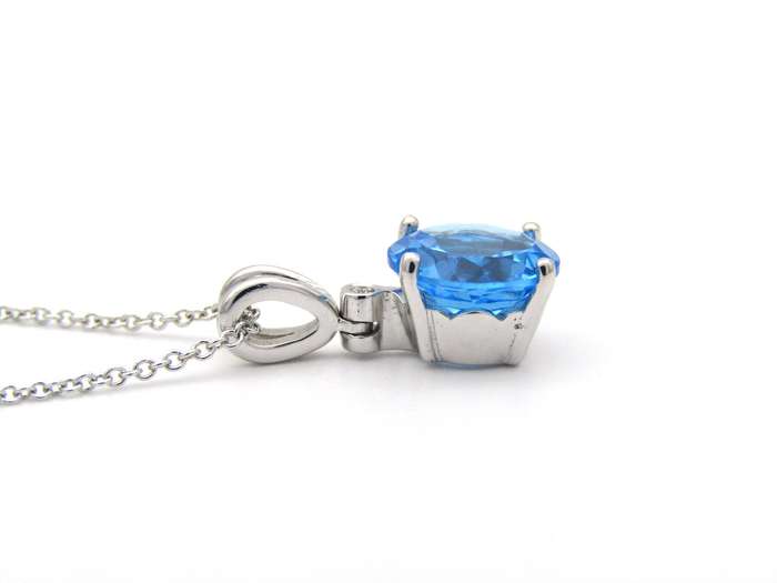 9K gold blue topaz and diamond pendant.