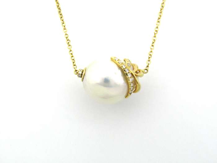 14K gold baroque pearl and diamond floating necklace.