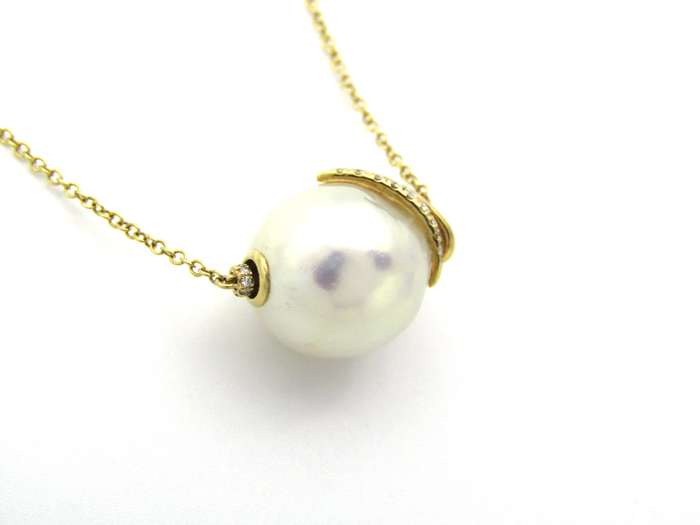 14K gold baroque pearl and diamond floating necklace.