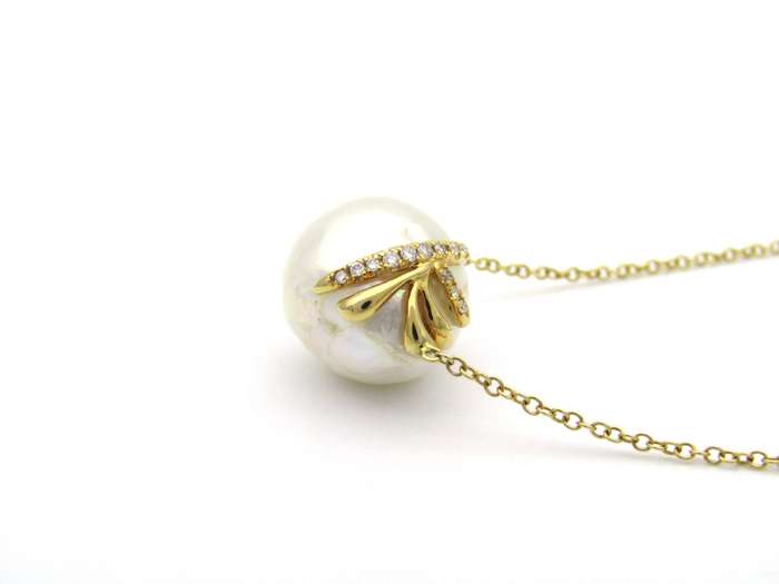 14K gold baroque pearl and diamond floating necklace.