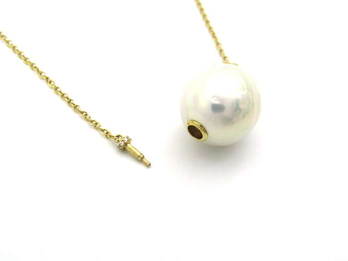 14K gold baroque pearl and diamond floating necklace.