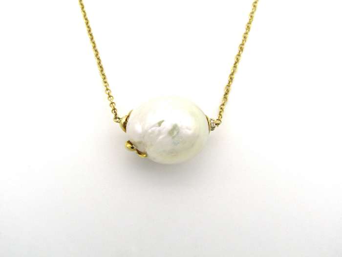 14K gold baroque pearl and diamond floating necklace.