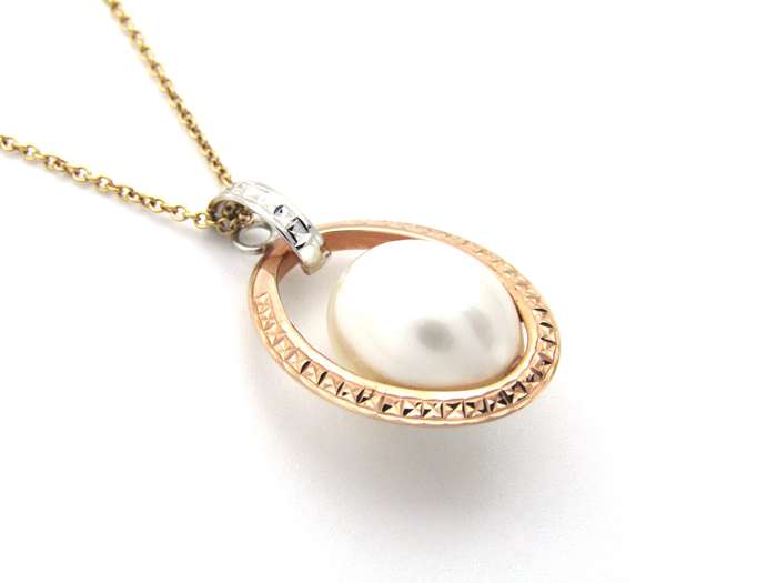 18K tri-gold freshwater pearl pendant with 18K gold chain.