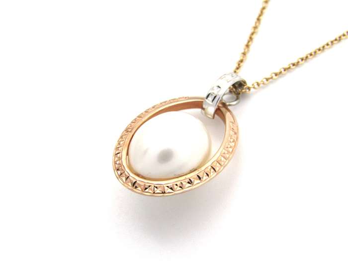 18K tri-gold freshwater pearl pendant with 18K gold chain.