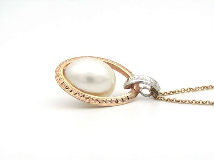 18K tri-gold freshwater pearl pendant with 18K gold chain.