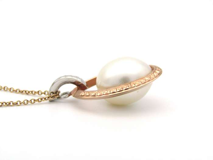 18K tri-gold freshwater pearl pendant with 18K gold chain.