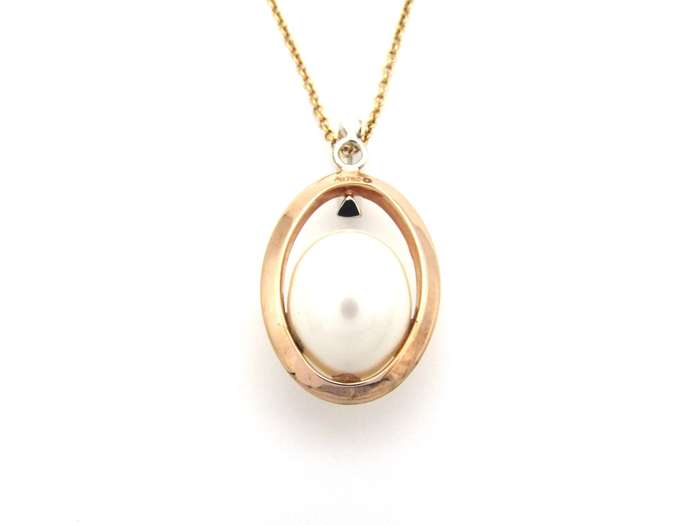 18K tri-gold freshwater pearl pendant with 18K gold chain.